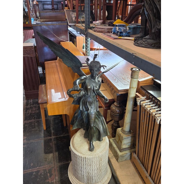 Statues of Victory often can have snakes as a symbol of triumph over chaos of Evil. Snakes represent both danger and the...
