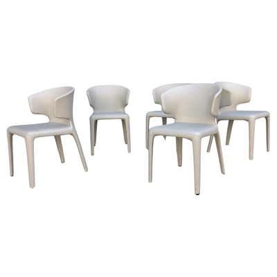 Cassina 367 Hola Armchairs designed by Hannes Wettstein in a cream leather. Set of 5, Featureing a distinctively sculpted...