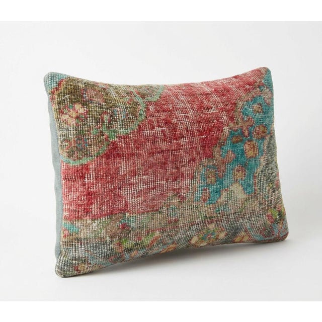 This beautiful 16'' x 24'' pillow cover was made from an authentic Turkish rug. Bright colors of wool adorn the front of...