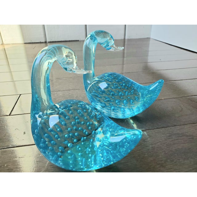 This sweet pair of vintage mouthblown glass swans can add a pop of color to any room decor. Nestled on the corner of your...