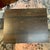 David Linley macassar side table with orange interior and wood veneer surround. Cube shaped with lit-orange interior gives...