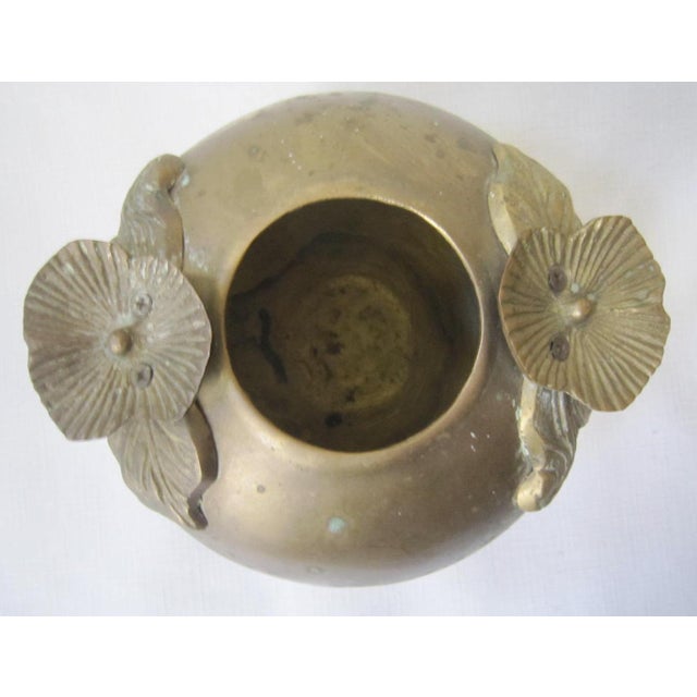 Art Noveau cast Brass Bowl with applied Butterfly Flower. It measures 7"D x 6.5"H.