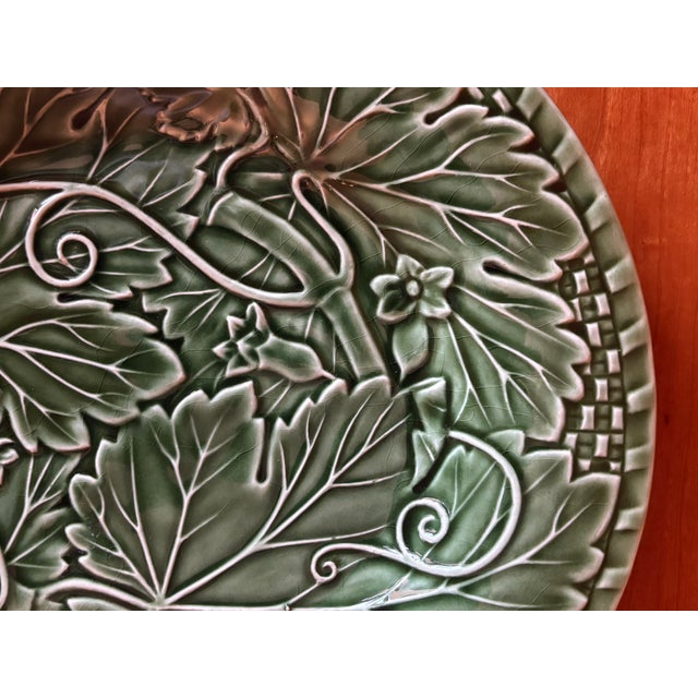 Beautifully detailed green majolica plate from Bordallo Pinheiro from the Vine Green collection featuring a vine and leaf...