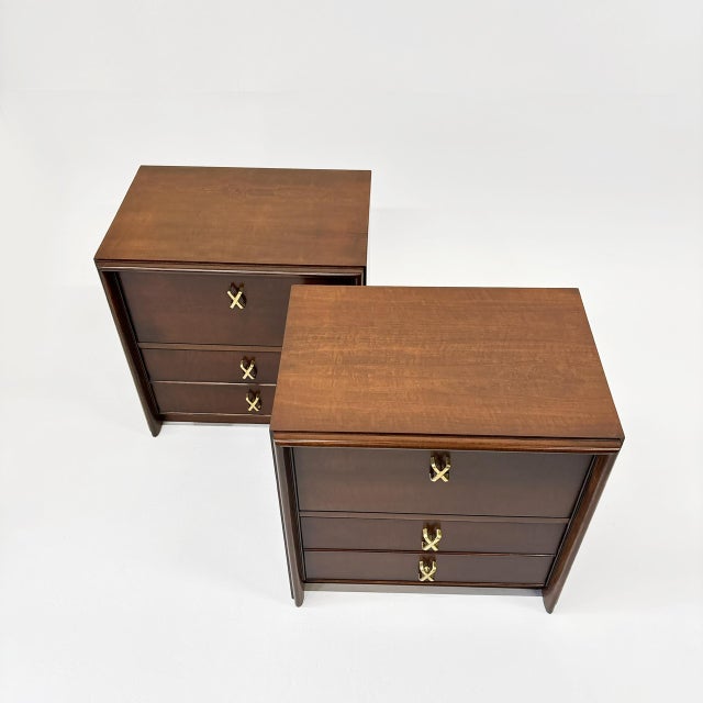 Pair of Rare Paul Frankl nightstands for John Stuart. Made of mahogany the USA, circa 1940. Each nightstand features a...