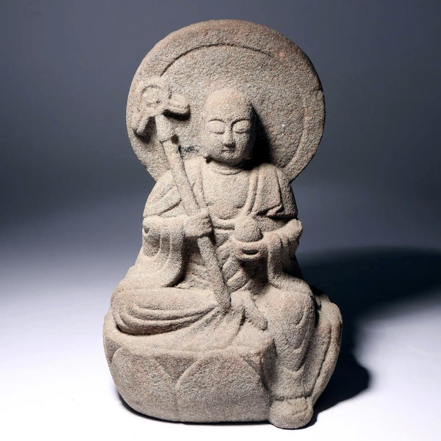 Carved out of a solid block of stone, this fine Japanese statue depicts Jizō Bosatsu, a beloved bodhisattva in Japan. Also...