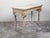 An Italian Neoclassical console table from the 18th century, with carved animals, fluted legs and distressed patina....