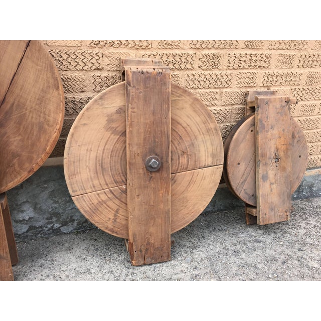 Trio of antique, industrial, maple wood dumb waiter pulleys circa the late 19th century are unique, early industrial...