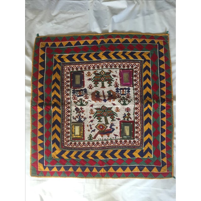 Vintage hand-beaded Indian tribal panel with mirror accents, surrounded by chevron-striped silk originally used as a wall...