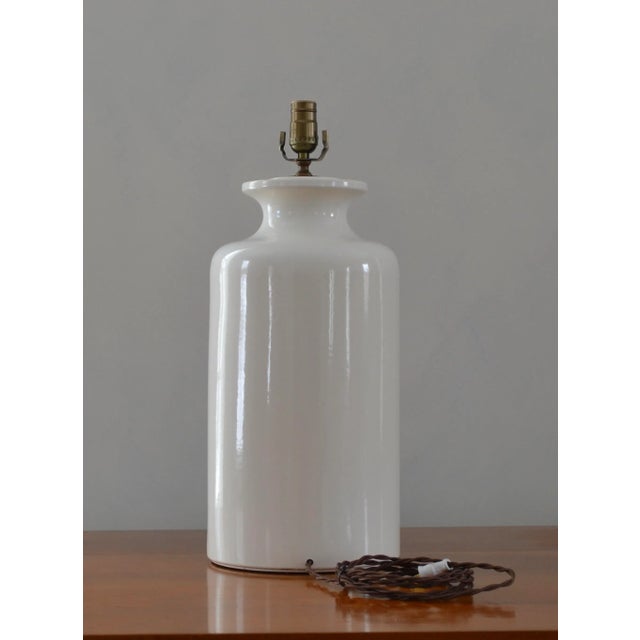 Large and cool white ceramic urn/jar lamp. Clean design lends itself to many design styles and influences.