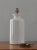 Large and cool white ceramic urn/jar lamp. Clean design lends itself to many design styles and influences.