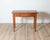 A charming late 18th century Tuscan side table crafted in solid walnut, displaying the understated elegance and...
