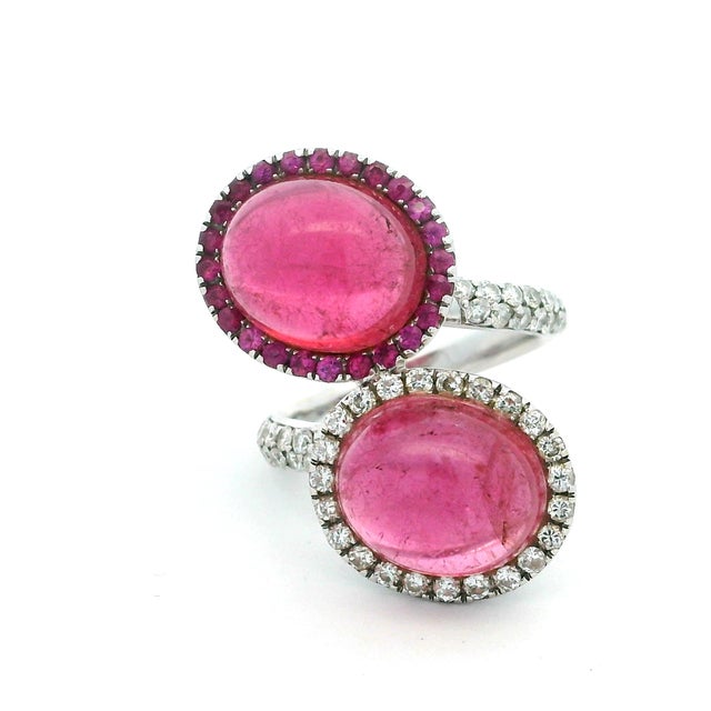 A sophisticated Italian cocktail ring dating to circa 1980, designed around two substantial pink tourmaline cabochons...