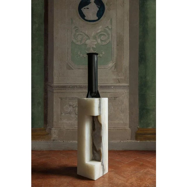 Urnette by rick owens 2007 dimensions: l 19 x w 19 x h 52 cm materials: bronze weight: 11 kg available in black finish or...