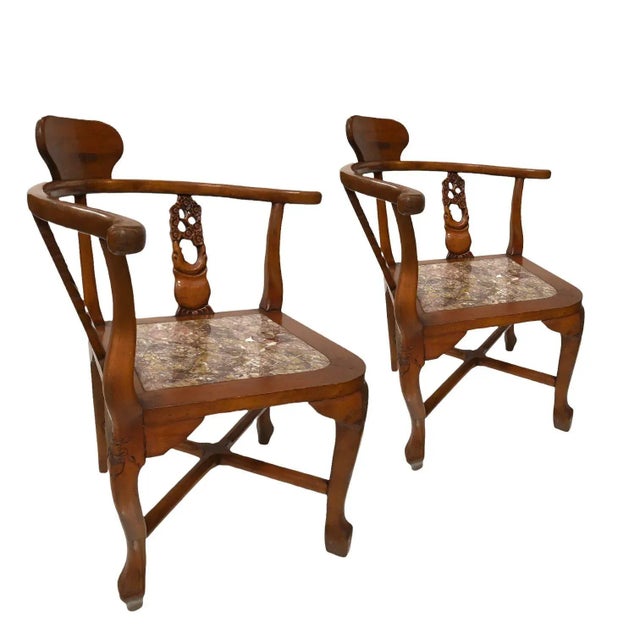 Chinoiserie Chinese-inspired Mid-century Rosewood Horseshoe Corner Chairs with Marble Seats designed by James Mount. These...
