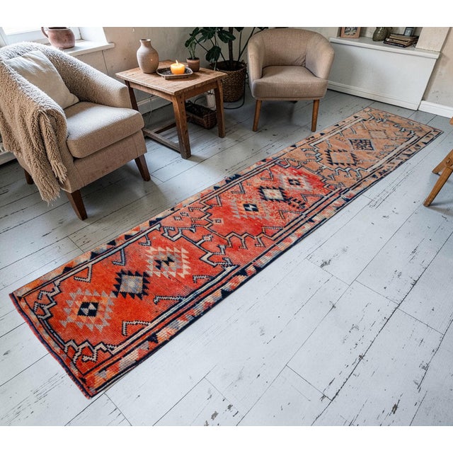 This exceptional vintage runner from 1960s Eastern Anatolia serves as a striking foundation for contemporary interiors,...