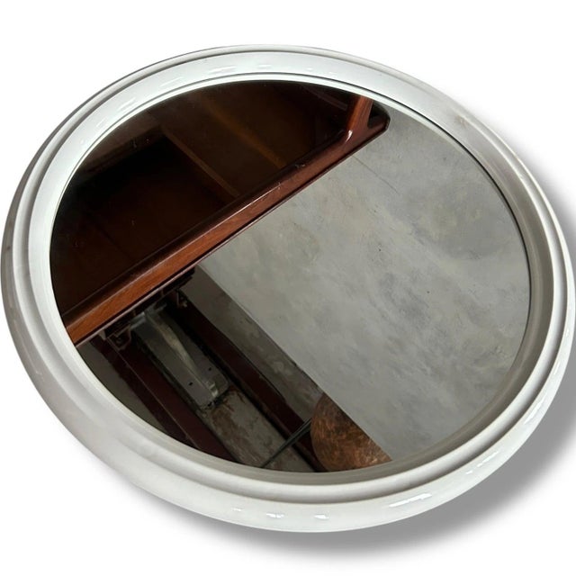 The Dutch Space Age Mirror is a 1970s wall mirror that brings a unique retro round mirror design to your home. This white...