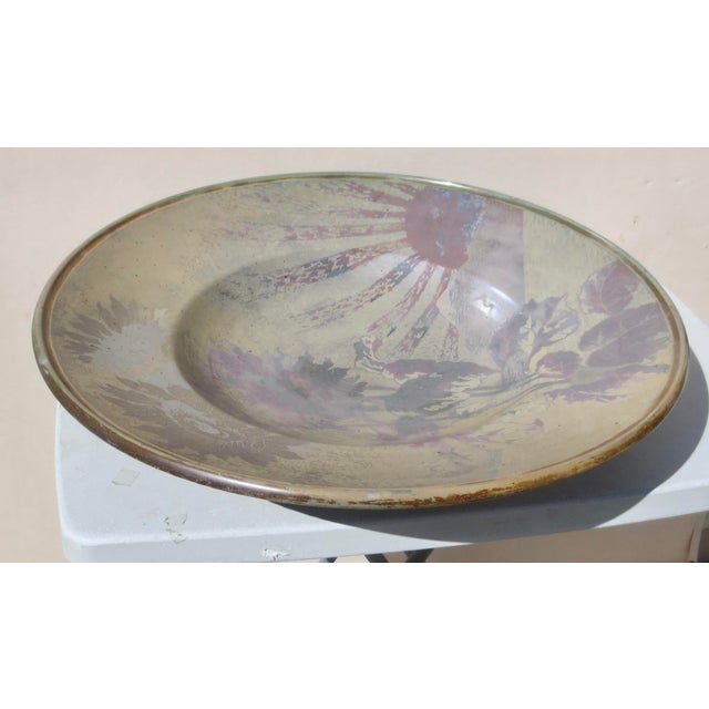 Luniville Clement Massier (Clément MASSIER (1844-1917) deep charger with floral pattern under a bright sunrise. Luminous...