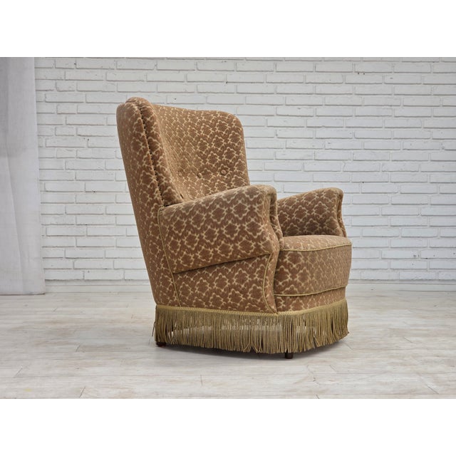 1960s, Danish armchair. Green/brown furniture velour, beech wood legs with brass plugs, brass springs in the seat....