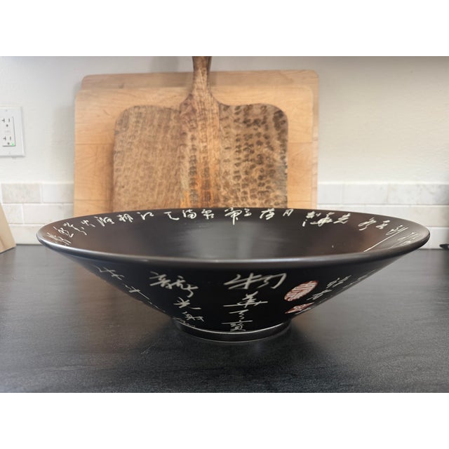 This is a large Kanji Chinese porcelain bowl. It is handmade and features beautiful calligraphy and signage. It is in...