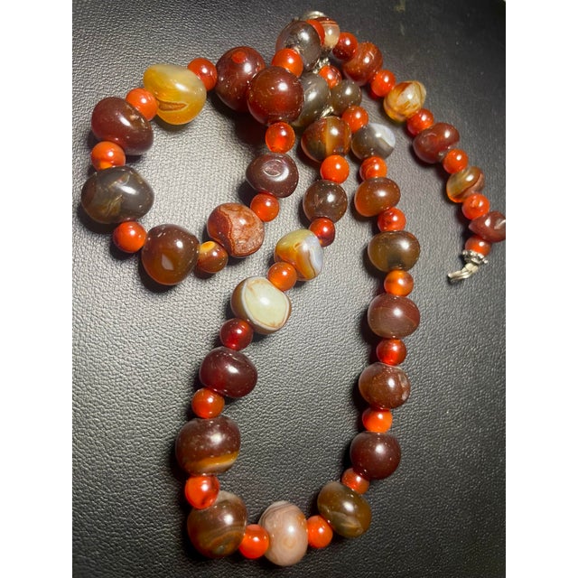 The necklace had larger beads Black grass agate (also known as ‘hei cao’) a rare variety of Nanhong (Southern Red) agate...