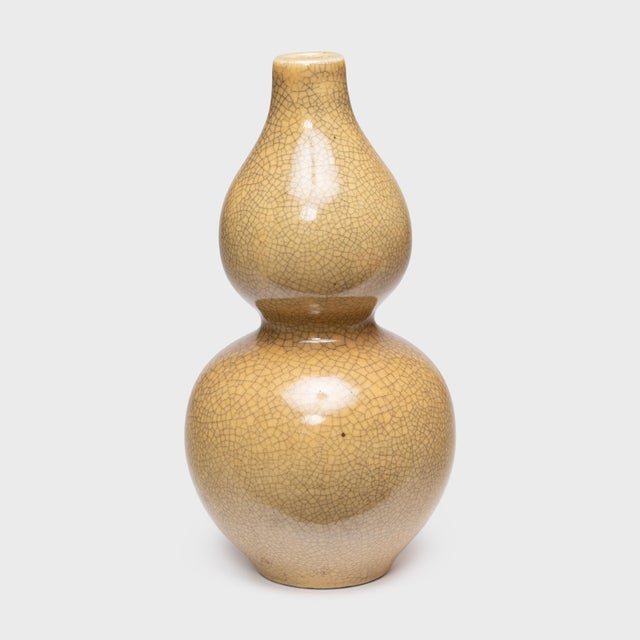 The graceful, hourglass form of this contemporary vase dates back as far as the Song dynasty (960-1279). Known as a...