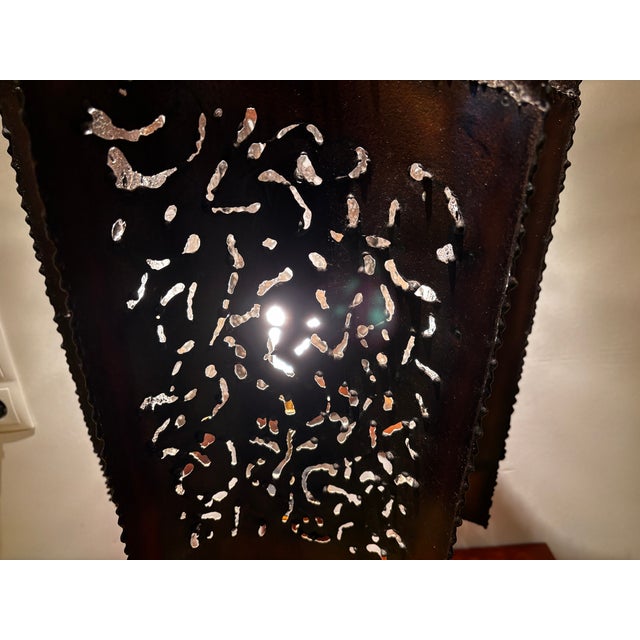 Large Brutalist ceramic table lamp with an openwork copper-colored metal shade featuring characteristic organic motifs, in...