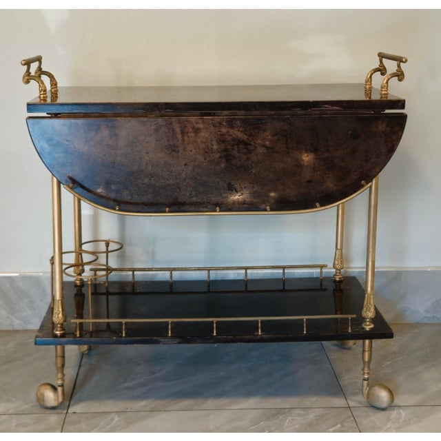 1950s Lacquered Goat Skin Bar Cart by Aldo Tura, Italy This incredible cart by Aldo Tura has a warmth and depth of color...