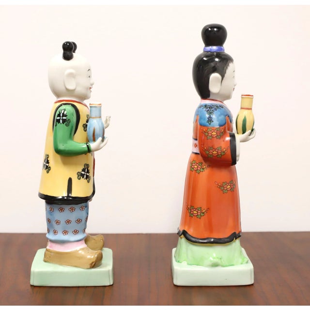 A pair of Asian style figurines depicting a traditional Chinese couple by Andrea by Sadek. Hand painted, multi-color...