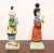 A pair of Asian style figurines depicting a traditional Chinese couple by Andrea by Sadek. Hand painted, multi-color...