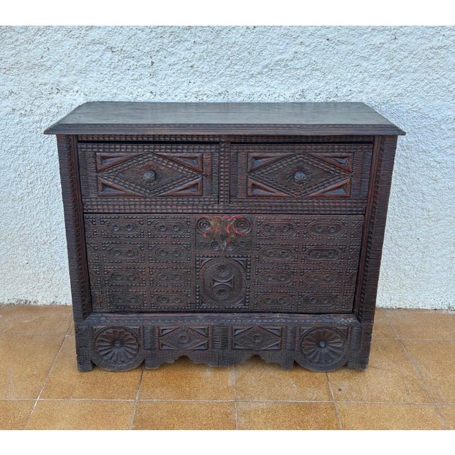 Striking Spanish carved wood cabinet in the Renaissance Revival tradition, dating to the late 19th century. This piece...