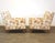 A pair of mid century modern maple leg lounge chairs with floral pattern fabric in the manner of possibly designed by Paul...