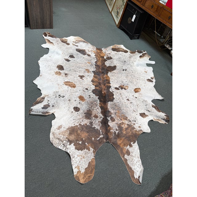 Design Plus Gallery presents a 7ft x 8ft Cow Print Hair on Hide Area Rug. This rug has real hair-on-hide leather sourced...