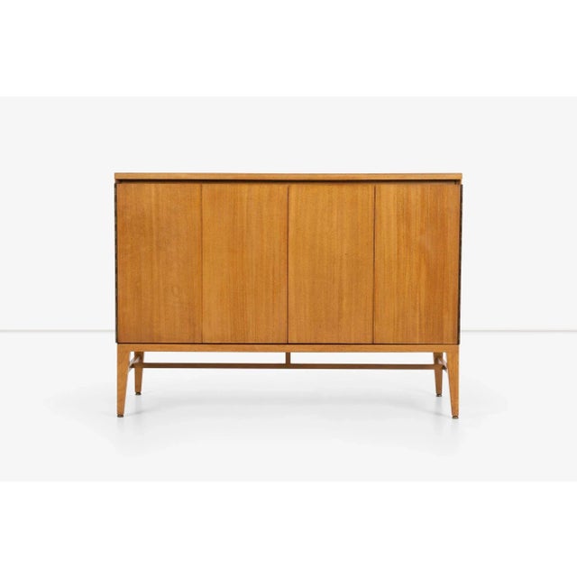 Paul McCobb Dresser for Calvin, features a rich Mahogany veneer. Its bi-fold doors, mounted on piano hinges, open up to...