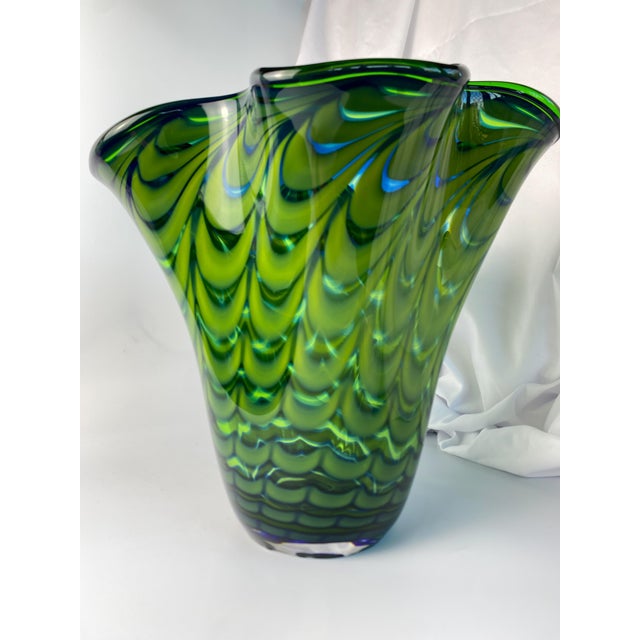 Stunning green Murano style bouquet vase with a spiral pulled feather pattern and ruffled shape. Dark and light green...