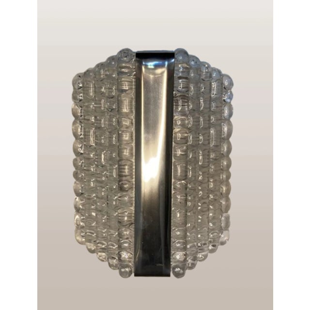 Step back in time with the Kaiser Leuchten wall lights, designed, 1960. This iconic piece of art captures the essence of...