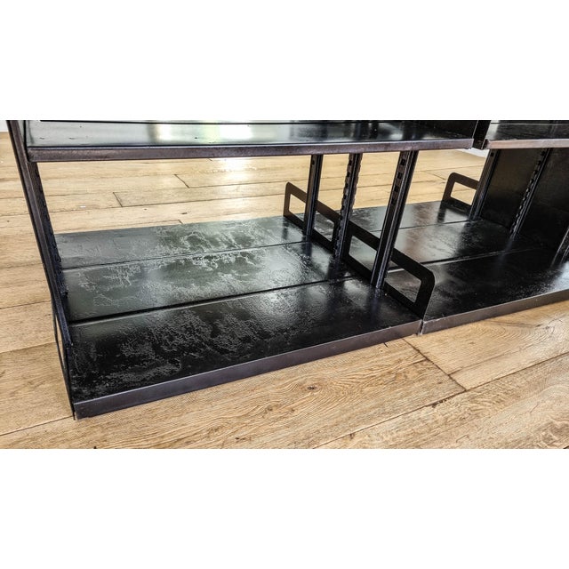 "Strafor" bookcase (Forges de Strasbourg) from the 1930s. Double-sided modular unit in black patinated steel, featuring...