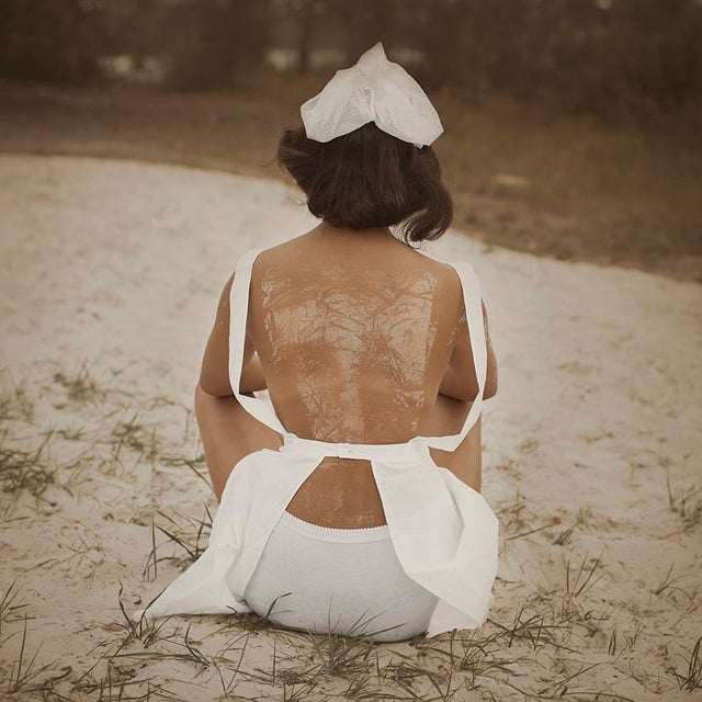 Lazy Afternoon by Dasha and Mari Beach Pondering, a model in white ponders on the beach sands, 2014. Limited edition print...
