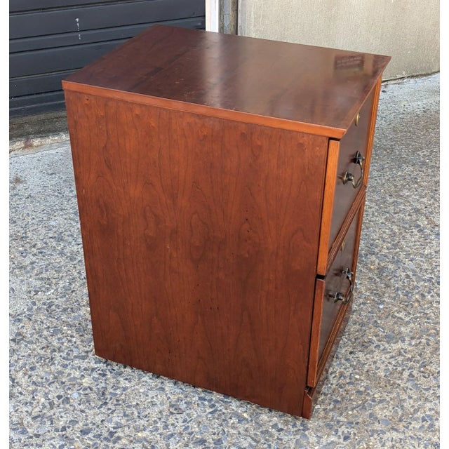 This file cabinet offers the perfect blend of style and practicality. Featuring a rich reddish-brown tone complemented by...