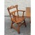 Solid wood construction with warm medium-tone finish. Armchair with flat arms; side chairs without arms. Side chairs:...