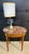 A fine quality French Oval Lamp Table. Having a drawer to the front and 2 slides either side. Adorned with parquetry and...