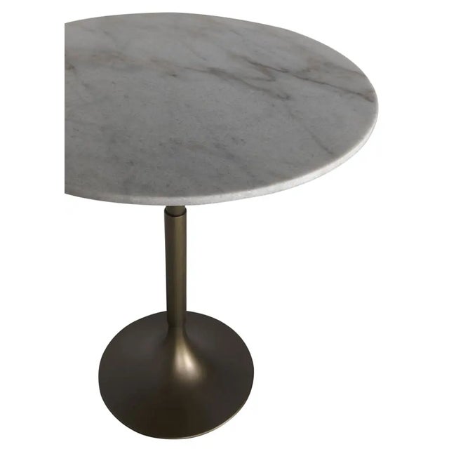 Elevate your space with the JMAN Bar Table in Aged Brass, where industrial charm meets timeless elegance. Featuring a...