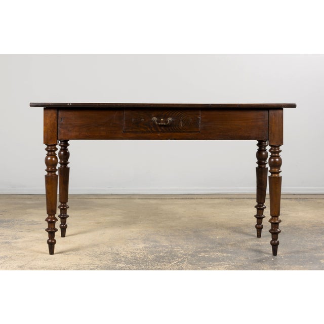 A charming late 19th-century French Provincial table in the Louis Philippe style, sourced from Provence. Expertly hand-...