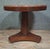 Elegant Empire-style side table in solid mahogany and mahogany veneer Resting on a central, slightly tapered, solid-...