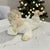 A Lladro Little Angel Reclining porcelain figurine, model #4541, produced in Spain during the late 20th century. Belonging...