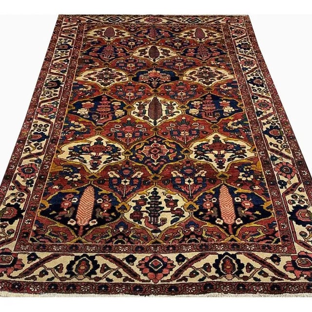 Traditional Vintage handwoven Animal Print Persian Bakhtiari area rug featuring an elegant allover design on a red colored...