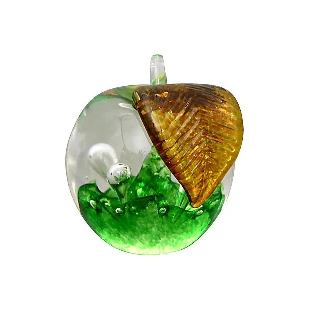 Midcentury art glass apple paperweight. Made in Scotland by Caithness Glass. Maker's mark etched on underside. Light wear.