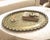 Large 24-inch vintage solid-brass wall tray with raised floral ornament, 1940s scalloped rim, and hanging hook for an...