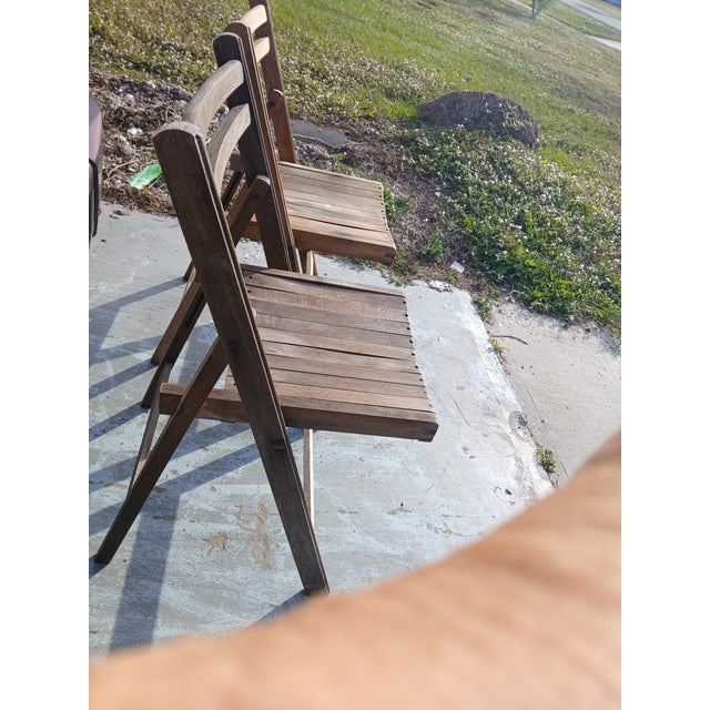These 1940s beautifully weathered teak folding chairs are from my Personal Collection and were obtained from my neighbor...