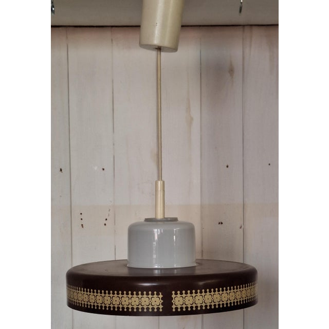Vintage Hanging Lamp with Opaque White Inner Glass Shade and Brown Metal Trim, 1970s, in Very Good conditions. Designed...