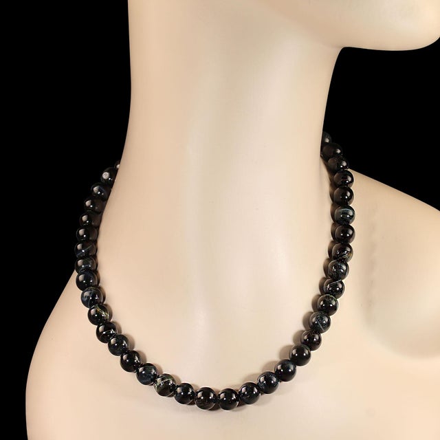 This 17‑inch necklace showcases the captivating beauty of optical gray‑blue Tiger’s Eye, a gemstone known for its shifting...